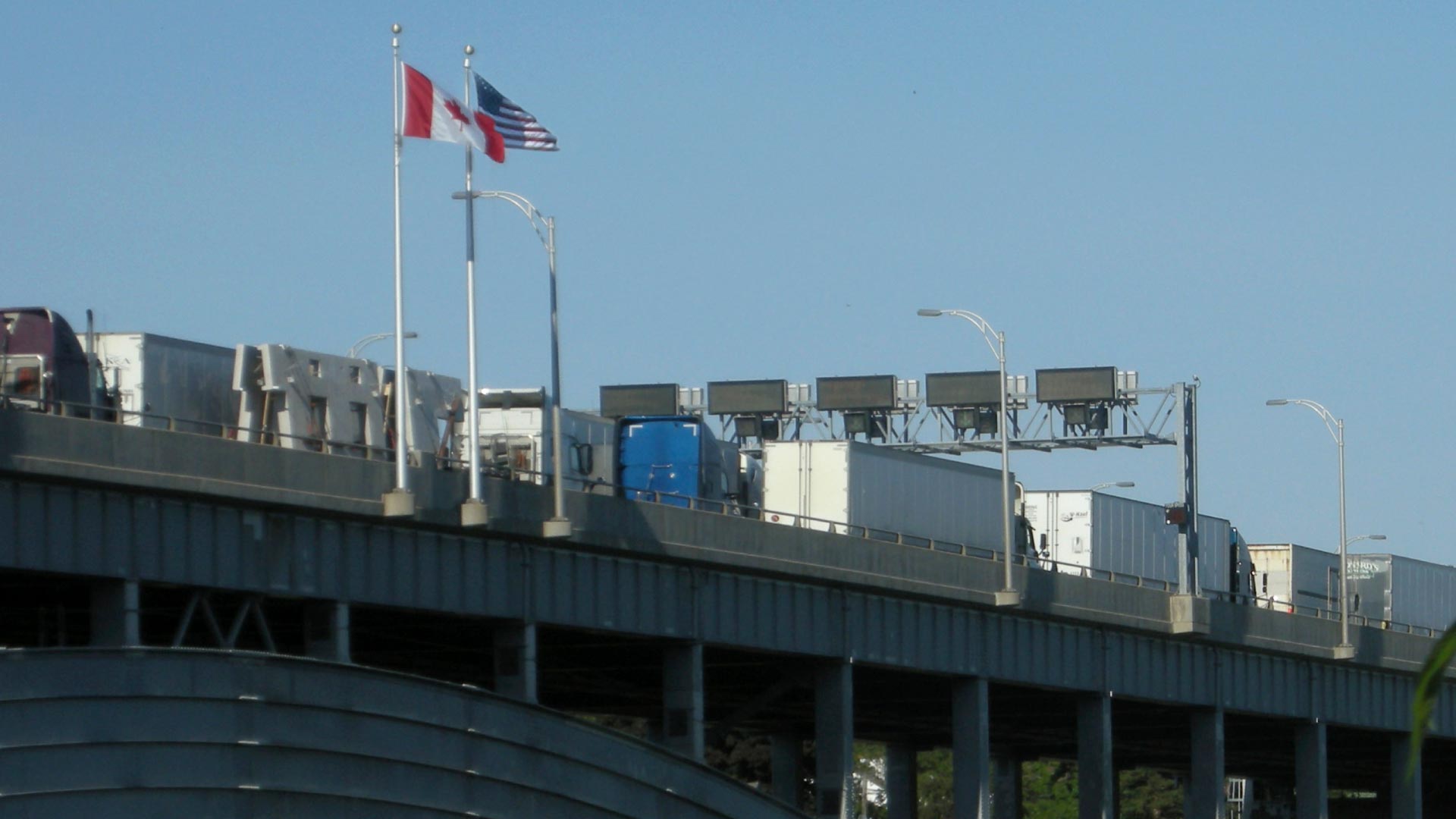 trucks-on-bridge-crossing-canadian-us-border